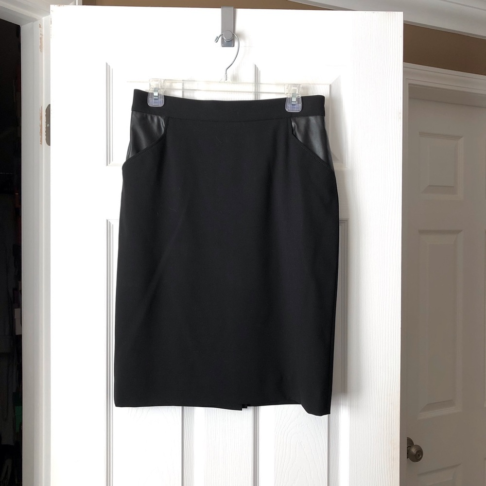 Black knee length skirt.